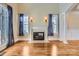 Elegant living room with hardwood floors, fireplace, and high ceilings at 6926 Linkside Ct, Charlotte, NC 28277