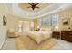 Bright bedroom with a tray ceiling, large windows, sitting area, and neutral decor at 6926 Linkside Ct, Charlotte, NC 28277
