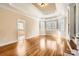 Main bedroom with hardwood floors, high ceilings and a view of the bathroom at 6926 Linkside Ct, Charlotte, NC 28277