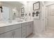 Modern double vanity bathroom with a large mirror and shower at 821 Blue Canyon Dr, York, SC 29745