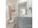 Bathroom with grey vanity, bathtub, and shower at 821 Blue Canyon Dr, York, SC 29745