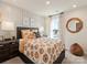 bedroom with lion bedding and wood accent wall at 821 Blue Canyon Dr, York, SC 29745