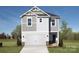 Two-story home with gray siding, white garage door, and landscaping at 821 Blue Canyon Dr, York, SC 29745