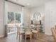 Bright dining area with glass-top table, wicker chairs, and sliding glass doors leading to patio at 841 Blue Canyon Dr, York, SC 29745