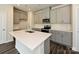 Kitchen boasts an island with white quartz countertops and gray cabinets at 853 Blue Canyon Dr, York, SC 29745