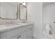 Bathroom with double vanity, marble countertop, and gold fixtures at 8788 Potter Rd, Matthews, NC 28104