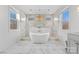 Elegant bathroom with marble shower, free-standing tub, and natural light at 8788 Potter Rd, Matthews, NC 28104