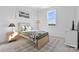 Cozy bedroom with twin bed, patterned rug and window at 8788 Potter Rd, Matthews, NC 28104