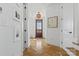 Bright entryway with herringbone floors and a view to the backyard at 8788 Potter Rd, Matthews, NC 28104