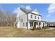 Two-story house with white siding, shutters, and front porch at 8788 Potter Rd, Matthews, NC 28104