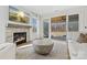 Cozy living room featuring a stone fireplace and sliding doors to patio at 8788 Potter Rd, Matthews, NC 28104