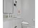 Modern powder room with marble vanity and gold fixtures at 8788 Potter Rd, Matthews, NC 28104