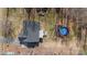 An aerial view showcases the house, pool, and surrounding greenery of the property at 888 Brevard Place Rd, Iron Station, NC 28080