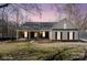 Charming single-story home with landscaped yard at 888 Brevard Place Rd, Iron Station, NC 28080