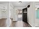 Inviting foyer with hardwood floors, an open door, and access to multiple rooms at 888 Brevard Place Rd, Iron Station, NC 28080