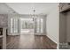 This living room features a fireplace and a sun room with wood-look flooring at 888 Brevard Place Rd, Iron Station, NC 28080