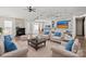 Bright, staged living room showcasing hardwood floors, a fireplace, and contemporary furniture at 888 Brevard Place Rd, Iron Station, NC 28080