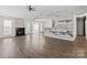 Spacious living room with a fireplace, unique wall accents, and hardwood floors at 888 Brevard Place Rd, Iron Station, NC 28080