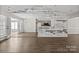 Open-concept living area with ample space, stylish decor, and access to outdoor living at 888 Brevard Place Rd, Iron Station, NC 28080