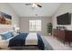 Bright main bedroom with a queen bed, modern decor, and an accent wall at 888 Brevard Place Rd, Iron Station, NC 28080