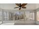 Sunroom with many windows looking out to the lush, wooded property at 888 Brevard Place Rd, Iron Station, NC 28080