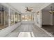 Bright sunroom featuring floor-to-ceiling windows and wood-look floors at 888 Brevard Place Rd, Iron Station, NC 28080