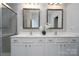 Double vanity bathroom with white cabinets, and frameless shower at 9115 Bluefield St, Charlotte, NC 28273