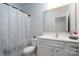 Simple bathroom with shower/tub combo and white vanity at 9115 Bluefield St, Charlotte, NC 28273