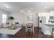 Open dining area with hardwood floors, adjacent to kitchen and living room at 9115 Bluefield St, Charlotte, NC 28273