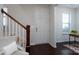 Bright entryway with stairs and neutral color palette at 9115 Bluefield St, Charlotte, NC 28273