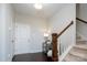 Entryway with staircase, wood floors, and coat rack at 9115 Bluefield St, Charlotte, NC 28273