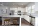 Modern kitchen with white cabinets, granite countertops, and stainless steel appliances at 9115 Bluefield St, Charlotte, NC 28273