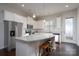 Modern kitchen with white cabinets, granite countertops, and stainless steel appliances at 9115 Bluefield St, Charlotte, NC 28273