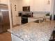 Kitchen with granite countertop and white cabinets at 106 Milliner Dr # 97, Troutman, NC 28166