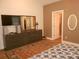 Main bedroom with dresser, TV and ensuite access at 106 Milliner Dr # 97, Troutman, NC 28166