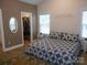 Main bedroom with blue bedding and walk-in closet at 106 Milliner Dr # 97, Troutman, NC 28166