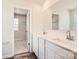 Bathroom featuring double sink vanity with white countertops and a walk-in closet at 1171 Blackburn Cir, Edgemoor, SC 29712