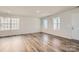 Bright living room with wood-look floors and natural light streaming through multiple windows at 1171 Blackburn Cir, Edgemoor, SC 29712