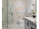 Modern bathroom featuring a glass enclosed shower with marble tiling, neutral walls, and white fixtures at 120 Trelawn St, Fort Mill, SC 29715