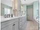 Bright bathroom features double sink vanity with plentiful storage, quartz countertop, and decorative bronze faucets at 120 Trelawn St, Fort Mill, SC 29715