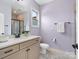 Bathroom with a vanity, large mirror, and a walk-in shower with glass door at 120 Trelawn St, Fort Mill, SC 29715