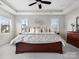 Bright, large bedroom with large windows, a ceiling fan, and bedside tables with lamps at 120 Trelawn St, Fort Mill, SC 29715