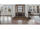 Inviting foyer featuring dark wood flooring, natural light, and an elegant entry door at 120 Trelawn St, Fort Mill, SC 29715