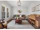 Cozy living room showcasing a decorative rug, piano, and comfortable seating arrangement at 120 Trelawn St, Fort Mill, SC 29715