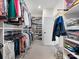 Organized walk-in closet features ample shelving, hanging rods, and convenient access to clothing and accessories at 120 Trelawn St, Fort Mill, SC 29715