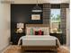 Spacious bedroom with a wooden bed frame and dark accent wall at 13124 Hampton Bay Ln, Charlotte, NC 28262