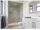 Clean bathroom with a walk-in shower, double vanity, and updated fixtures at 1333 Queens Rd # D4, Charlotte, NC 28207