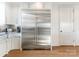 Modern kitchen with a farmhouse sink and stainless steel refrigerator at 1333 Queens Rd # D4, Charlotte, NC 28207