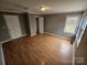 Spacious bedroom with laminate wood floors and a closet at 13655 Broadway Ave, Midland, NC 28107