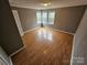 Simple bedroom with laminate flooring and neutral walls at 13655 Broadway Ave, Midland, NC 28107